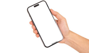 Hand holding smartphone with blank screen isolated on white background.